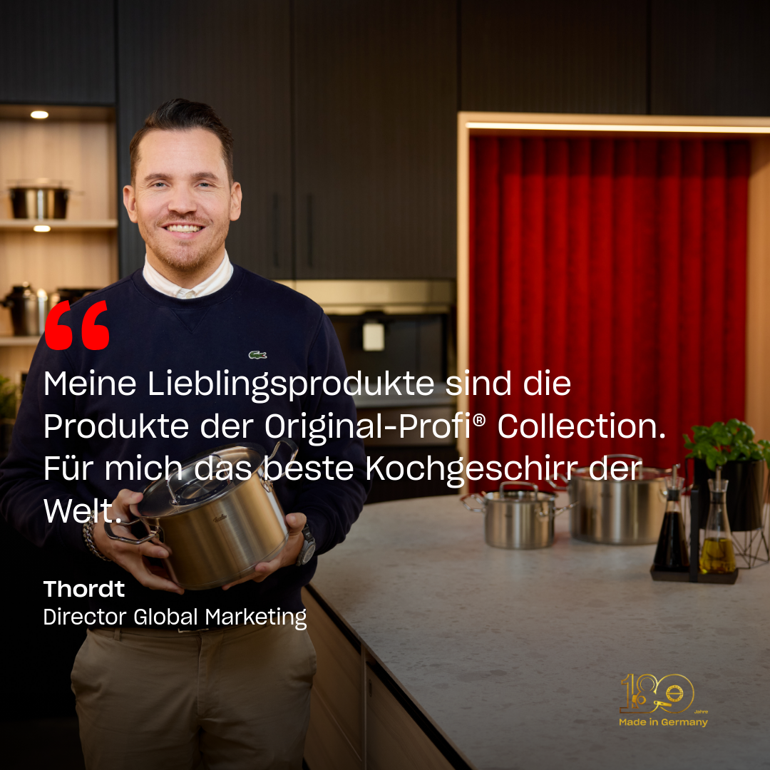 A smiling man in an elegant kitchen holds a Fissler pot; premium Cookware and his quote in German highlight quality "Made in Germany".