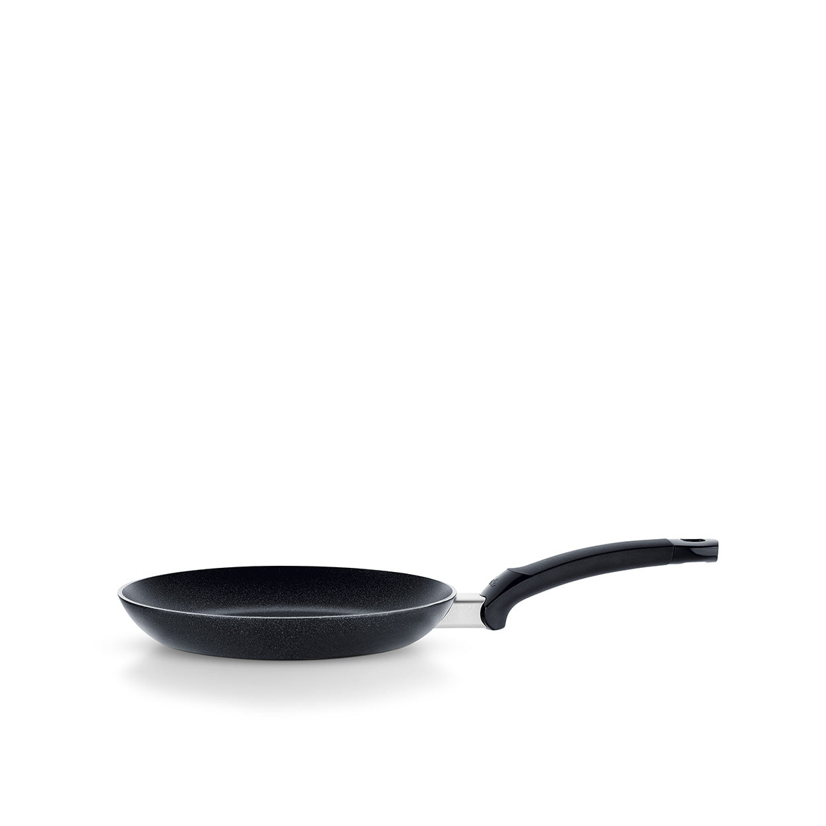 Fissler Levital®+ Flat Pan in black, precision engineering in Germany since 1845, with curved handle, on white background.