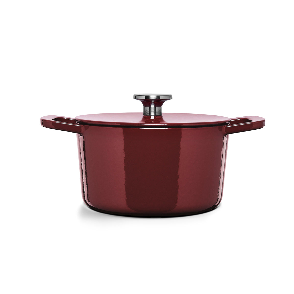Fissler Moments cast iron pot in red, energy-efficient, with two handles and lid. Modern design against a white background.