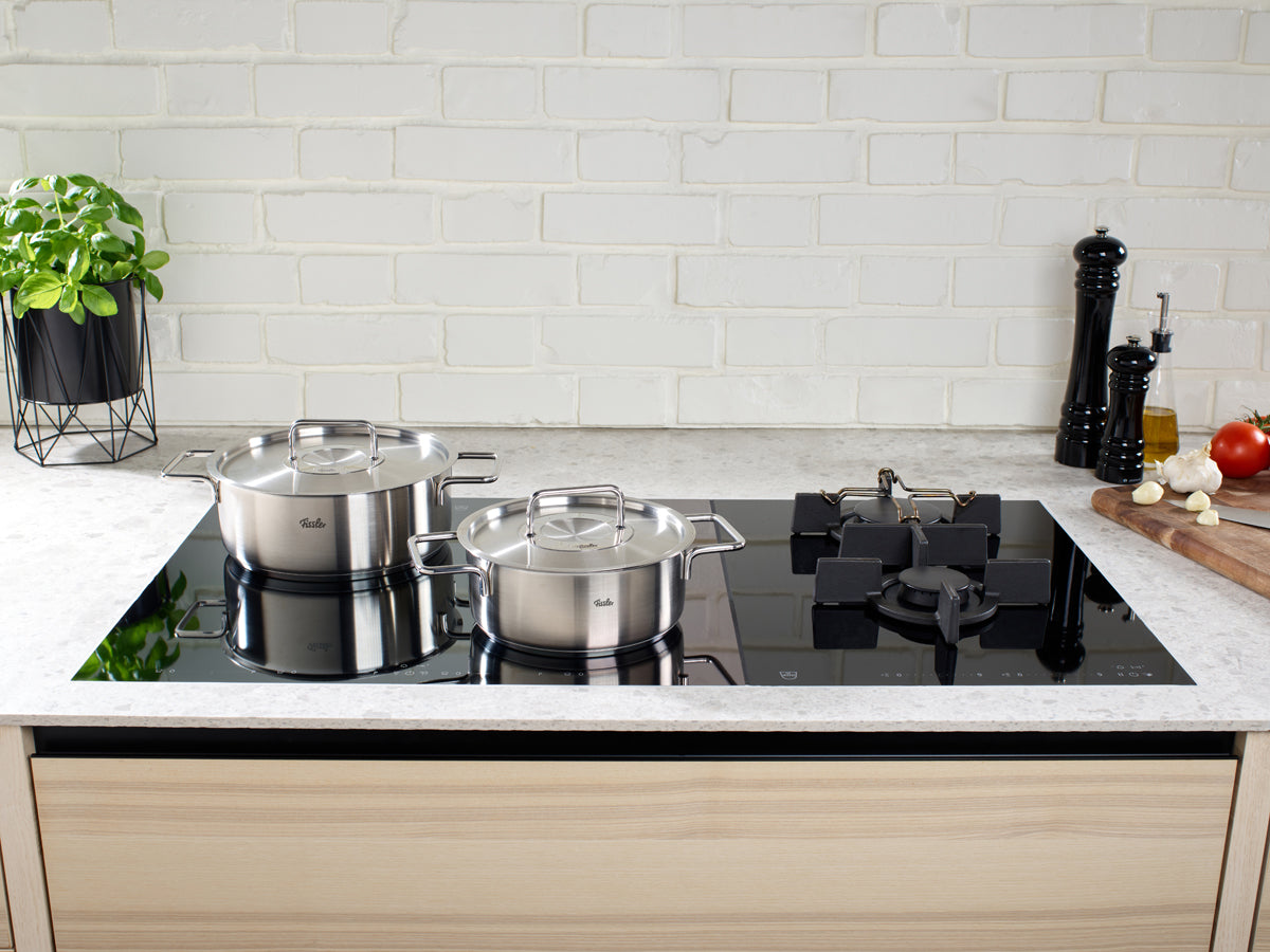 A modern kitchen with two Fissler Pure Collection roasting pans with Metal Lid is an example of German precision and timeless design.