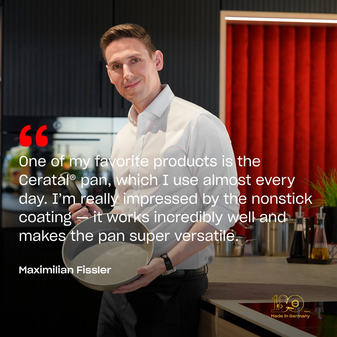 A man in a white shirt stands in a sleek, modern kitchen, proudly holding a Fissler nonstick frying pan. Next to him, a quote highlights the pan's exceptional versatility and effectiveness. Behind him, elegant kitchen accessories and stainless steel cookware add to the sophisticated atmosphere, reflecting Fissler’s heritage of precision engineering and timeless German design.