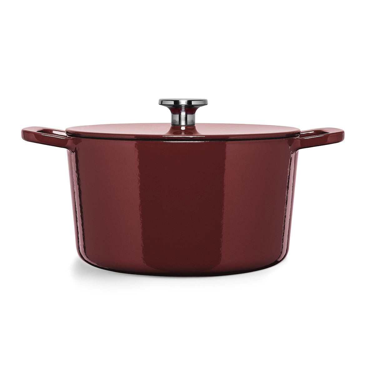 Fissler Moments Collection burgundy cast iron Dutch oven with lid and two handles, made in Germany, on a white background.
