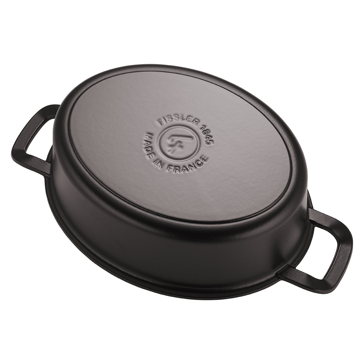 An inverted black oval Fissler Original-Profi Collection® cast iron roaster has "Fissler 1845 Made in France" inscribed on its bottom.