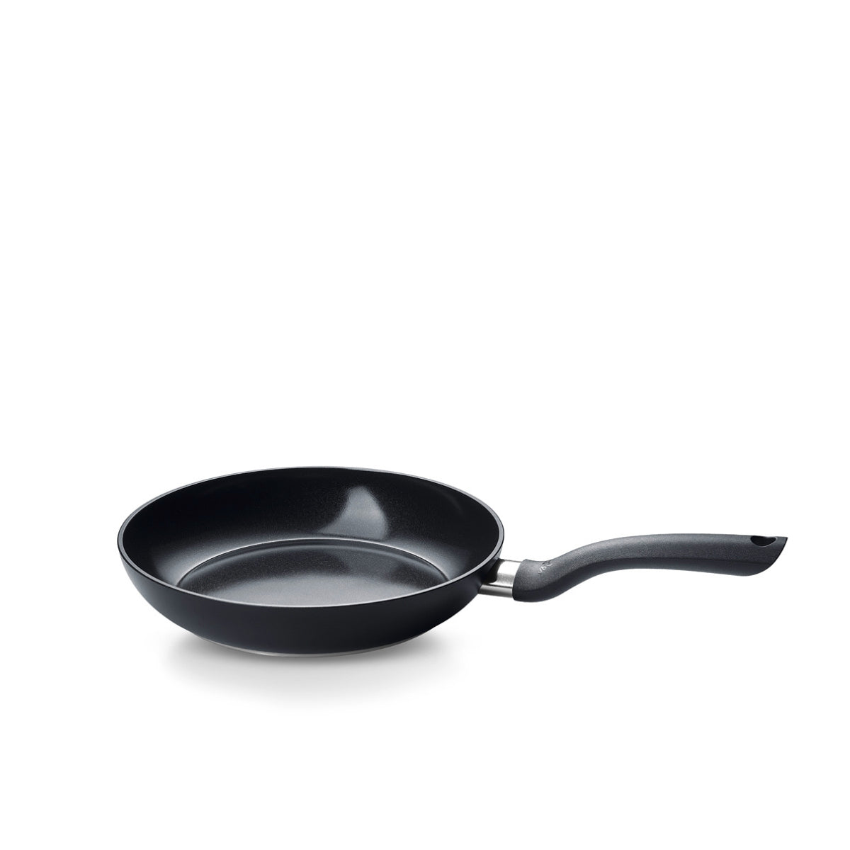 Fissler Essential® Frying Pan - modern PFAS/PTFE-free non-stick frying pan with ergonomic handle. Made in Germany. Shown at an angle.