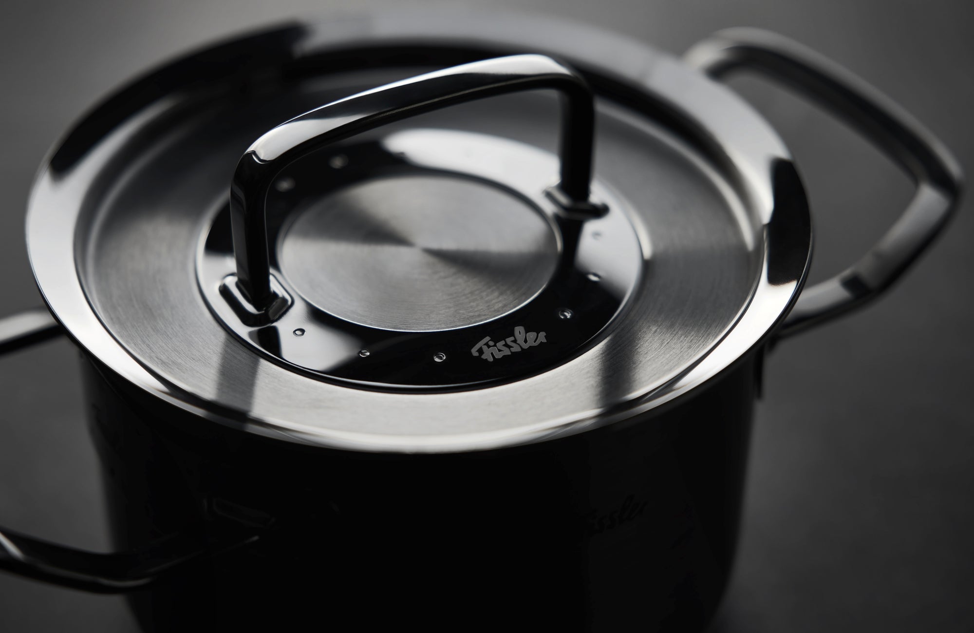 Fissler Original-Profi Collection® Shadowline 5-pc. Stainless Steel Set, Precision "Made in Germany," with depicted brand logo.