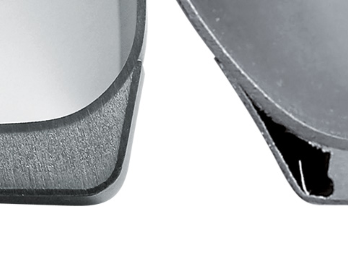 Close-up of two stainless steel surfaces: left side with a precise bevel cut, right side with a rough, irregularly torn edge.